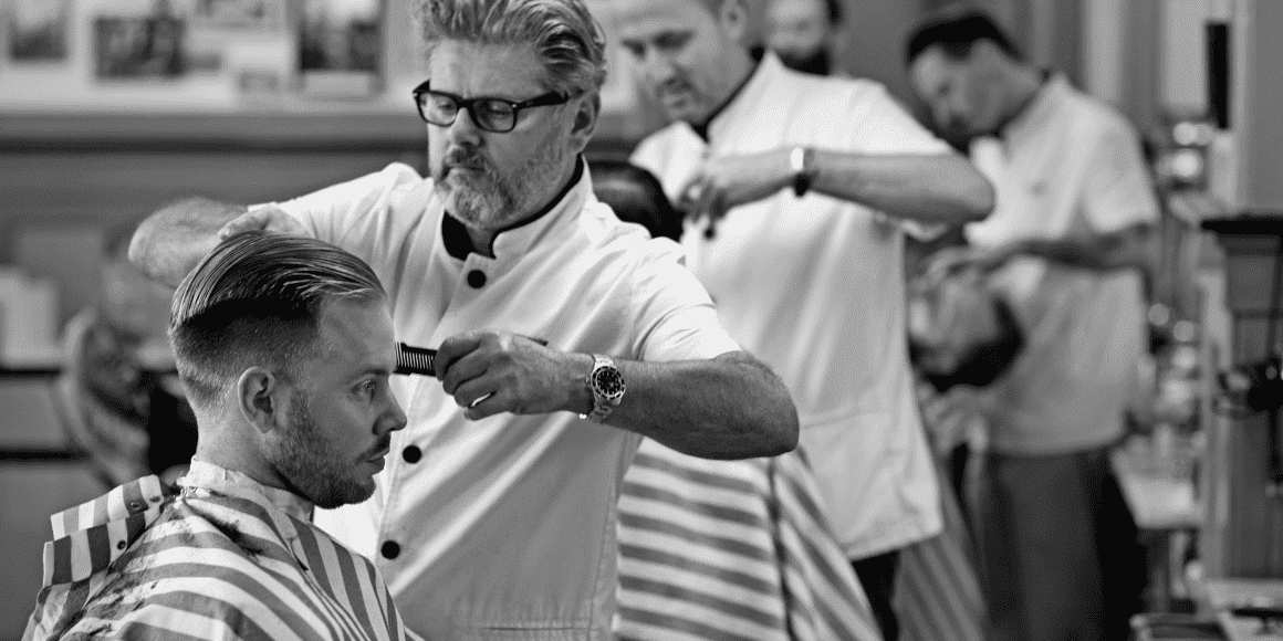 Hairdresser cutting hair